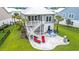 A beautiful backyard featuring a patio with lounge chairs and an outdoor dining set, perfect for entertaining at 277 Splendor Circle, Murrells Inlet, SC 29576