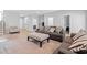 Spacious living room featuring a grey sofa and a patterned ottoman at 277 Splendor Circle, Murrells Inlet, SC 29576