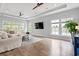Inviting living space boasts hardwood floors, a comfortable seating arrangement, and ample natural light at 277 Splendor Circle, Murrells Inlet, SC 29576