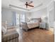 Spacious main bedroom with a ceiling fan and hardwood floors at 277 Splendor Circle, Murrells Inlet, SC 29576