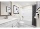 A beautifully designed bathroom featuring a vanity with framed mirror and shower with decorative shower curtain at 2828 Rowyn St., Longs, SC 29568