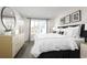 Serene main bedroom featuring a large window, dresser, and modern decor at 2828 Rowyn St., Longs, SC 29568