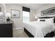 Comfortable bedroom featuring a queen-sized bed, soft carpet, neutral color palette, and bright natural light at 2828 Rowyn St., Longs, SC 29568