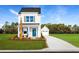 Charming two-story home with a blue front door, nice lawn and separate garage at 2828 Rowyn St., Longs, SC 29568