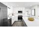 Modern kitchen with white cabinets, stainless steel appliances, and a large island at 2828 Rowyn St., Longs, SC 29568