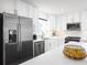Contemporary kitchen featuring white cabinets, stainless steel appliances, and a spacious island at 2828 Rowyn St., Longs, SC 29568