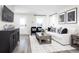 Inviting living room featuring modern decor, stylish furniture, and lots of natural light at 2828 Rowyn St., Longs, SC 29568