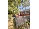 A home's exterior view reveals a charming deck and a lush backyard at 3110 Pinewood Dr., Loris, SC 29569