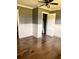 Bedroom with hardwood floors, closet with doors, gray walls and white trim and chair rail at 3110 Pinewood Dr., Loris, SC 29569