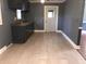 Kitchen featuring tile floors, gray walls and cabinets with sink at 3110 Pinewood Dr., Loris, SC 29569