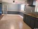 Kitchen featuring tile floors, gray walls and cabinets with sink and breakfast area at 3110 Pinewood Dr., Loris, SC 29569