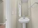 Well-lit powder room featuring pedestal sink, mirror, and neutral wall color at 347 Leste Rd., Myrtle Beach, SC 29588