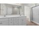 Bathroom features a double vanity, large mirror, and a glass enclosed shower at 347 Leste Rd., Myrtle Beach, SC 29588