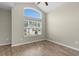 Bedroom features vaulted ceilings, wood-look flooring, and a large window at 347 Leste Rd., Myrtle Beach, SC 29588