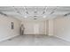 Spacious two-car garage featuring concrete flooring and neutral painted walls at 347 Leste Rd., Myrtle Beach, SC 29588