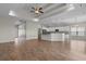 Open-concept space featuring a tray ceiling, hardwood floors, and seamless connection to the kitchen at 347 Leste Rd., Myrtle Beach, SC 29588