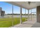 Screened-in porch with ceiling fan overlooking backyard and pond at 347 Leste Rd., Myrtle Beach, SC 29588