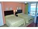 Serene bedroom with two beds and ocean view, creating a relaxing retreat at 3500 N Ocean Blvd. # 701 702, North Myrtle Beach, SC 29582