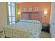 Comfortable bedroom with a large bed, stylish lamps, and a view of the outside at 3500 N Ocean Blvd. # 701 702, North Myrtle Beach, SC 29582