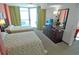 Comfortable bedroom with two beds, dresser, and a view of the ocean at 3500 N Ocean Blvd. # 701 702, North Myrtle Beach, SC 29582