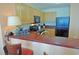 Modern kitchen with sleek appliances, granite countertops, and breakfast bar seating at 3500 N Ocean Blvd. # 701 702, North Myrtle Beach, SC 29582