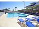 Outdoor pool surrounded by lounge chairs and palm trees at 3500 N Ocean Blvd. # 701 702, North Myrtle Beach, SC 29582