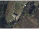 Aerial view of an expansive property with mature trees, open land, and multiple structures at 364 Jamie Rd., Galivants Ferry, SC 29544