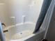 White bathtub featuring a shower faucet, shower head, and shower curtain at 364 Jamie Rd., Galivants Ferry, SC 29544