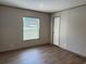 Bedroom showcasing vinyl flooring, a window with blinds, and neutral walls at 364 Jamie Rd., Galivants Ferry, SC 29544