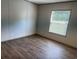 Bedroom showcasing vinyl flooring, a window with blinds, and neutral walls at 364 Jamie Rd., Galivants Ferry, SC 29544
