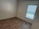 This bedroom features wood-look flooring and a window providing natural light at 364 Jamie Rd., Galivants Ferry, SC 29544
