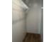 Walk-in closet featuring white shelving and a wood-look floor at 364 Jamie Rd., Galivants Ferry, SC 29544