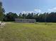 A single-Gathering home featuring modern siding and a spacious front yard with a shed at 364 Jamie Rd., Galivants Ferry, SC 29544