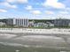 Extensive beachfront view with condos and single Gathering homes just across the dunes at 4105 S Ocean Blvd. # 102, North Myrtle Beach, SC 29582