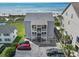 Aerial view of a condo building and the surrounding grounds including parking and trees at 4105 S Ocean Blvd. # 102, North Myrtle Beach, SC 29582