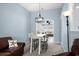 Cozy dining area with a modern light fixture and seating for four people at 4162 Dupree Dr., Little River, SC 29566