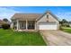 Well-maintained home with a two-car garage and landscaped front yard at 4162 Dupree Dr., Little River, SC 29566