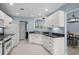 Beautiful open kitchen with white cabinets and stainless steel appliances at 4162 Dupree Dr., Little River, SC 29566