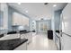 Bright kitchen features white cabinets, appliances, and sleek countertops at 4162 Dupree Dr., Little River, SC 29566