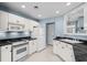 Well-lit kitchen equipped with modern appliances and ample counter space at 4162 Dupree Dr., Little River, SC 29566