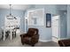 Inviting living room featuring comfortable leather seating and light blue walls at 4162 Dupree Dr., Little River, SC 29566