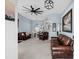 Spacious living room with modern fan, beautiful furnishings and soft, neutral carpet at 4162 Dupree Dr., Little River, SC 29566