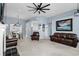 Spacious living room featuring blue walls, plush carpeting, and comfortable seating at 4162 Dupree Dr., Little River, SC 29566
