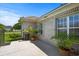 Relaxing patio with potted plants, a brick exterior, and an open space for seating at 4162 Dupree Dr., Little River, SC 29566