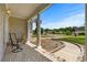 Relaxing front porch with brick flooring and elegant columns, perfect for enjoying the outdoors at 4162 Dupree Dr., Little River, SC 29566