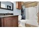 Cozy bathroom with a vanity, toilet, and a shower with a shower curtain at 4221 Hibiscus Dr. # 8-203, Little River, SC 29566
