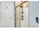 Bright bathroom features a glass door shower and white tiled walls at 4221 Hibiscus Dr. # 8-203, Little River, SC 29566