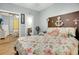 Nautical themed bedroom boasts an anchor headboard, mirror closet, and ensuite bath at 4221 Hibiscus Dr. # 8-203, Little River, SC 29566
