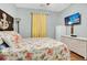 Comfortable bedroom featuring beach themed decor, a TV and a dresser at 4221 Hibiscus Dr. # 8-203, Little River, SC 29566