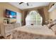 Well-lit bedroom featuring hardwood floors, bright walls, and a large window at 4221 Hibiscus Dr. # 8-203, Little River, SC 29566